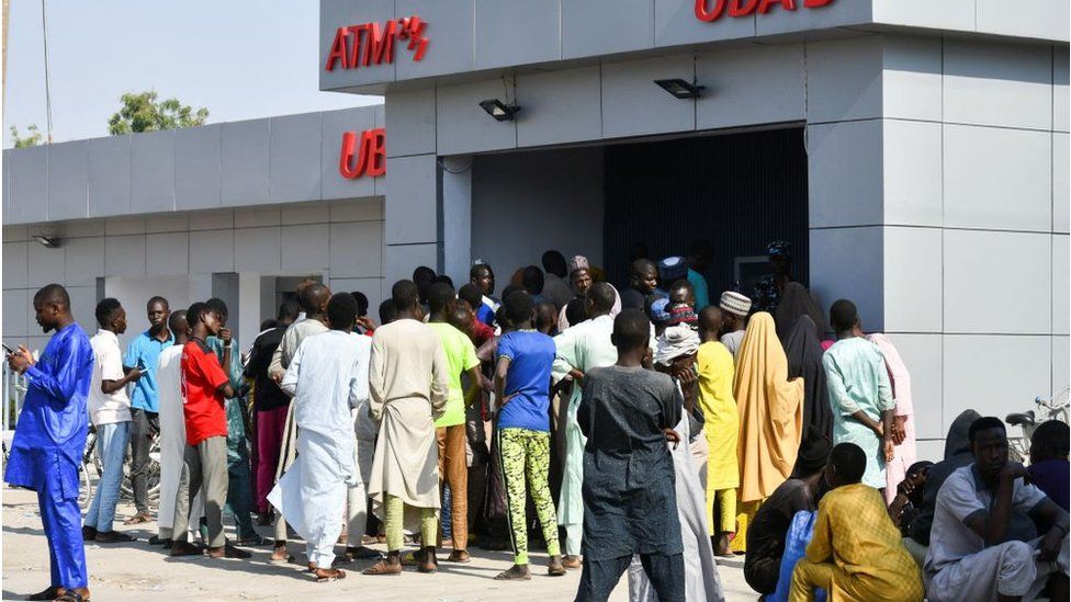 People lining up by ATM