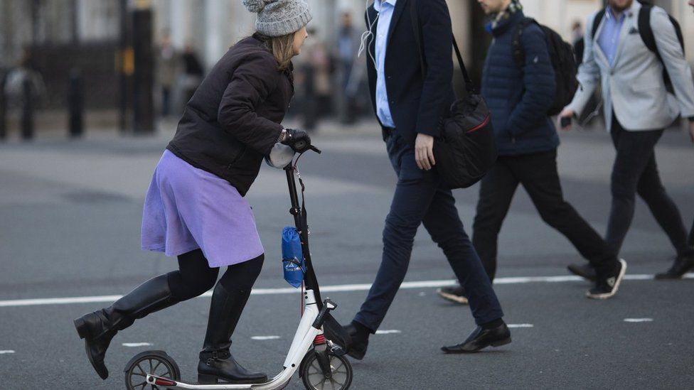 A woman on a scooter