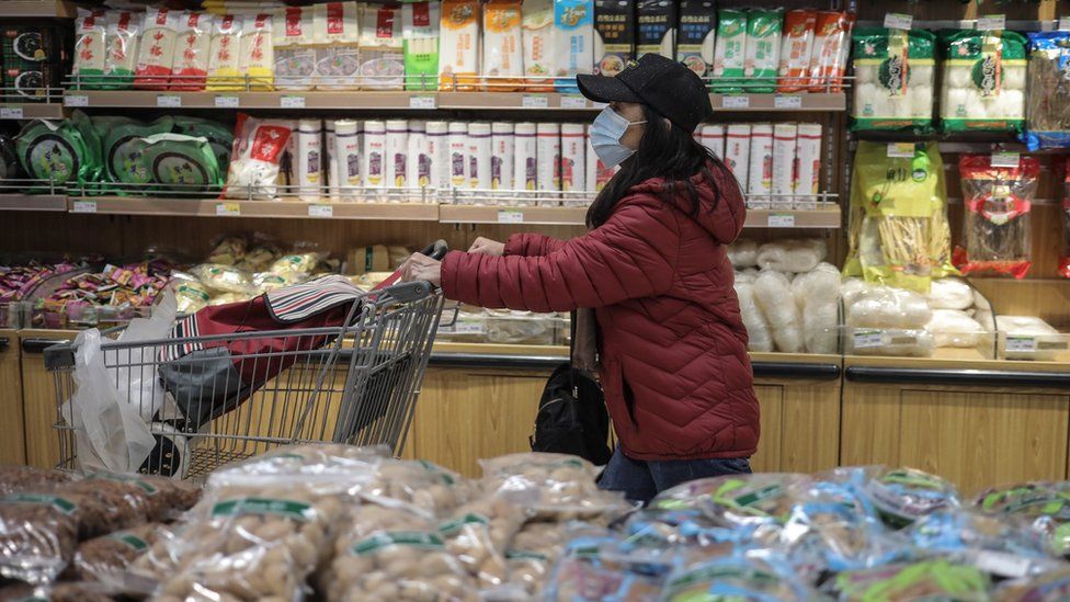 A woman shops in a supermarket in Beijing, China, 02 November 2021.