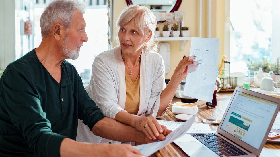 Pensioners by a computer