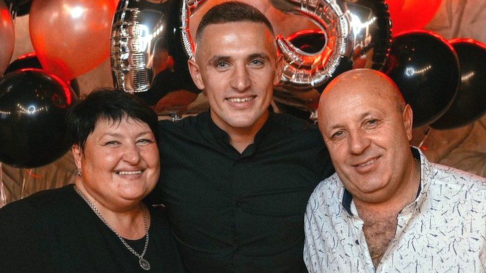 A family photo of Olha Sukhenko, her husband Igor and her son Oleksander