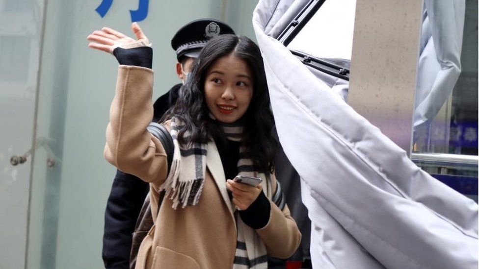Zhou Xiaoxuan, also known by her online name Xianzi, waves as she enters a court for a sexual harassment case involving a Chinese state TV host, in Beijing, China December 2, 2020.
