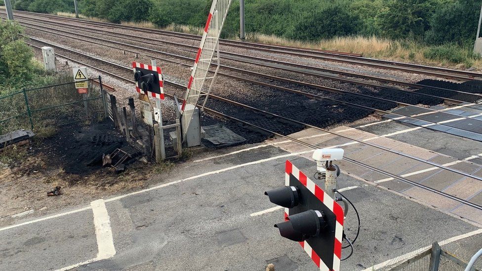Shows damage caused by a fire on the line to Peterborough