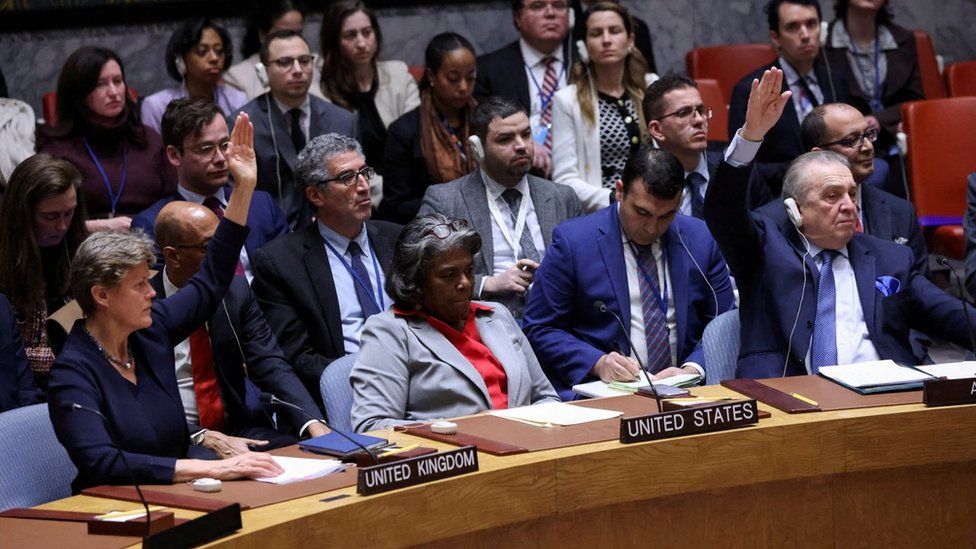UK envoy to the UN Barbara Woodward and Algeria's envoy Amar Bendjama vote in favour of a UN Security Council resolution demanding an immediate ceasefire in Gaza, at the UN's headquarters in New York (25 March 2024)