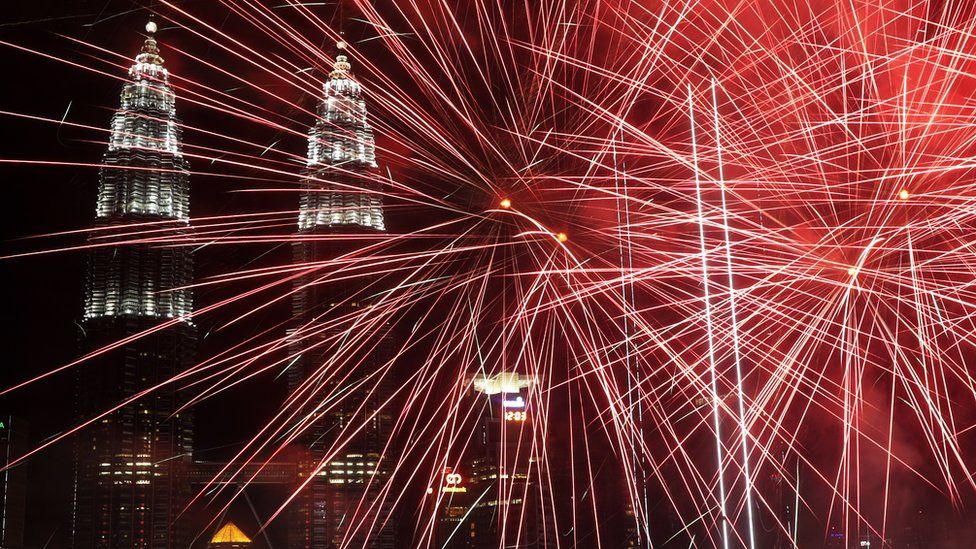 Fireworks illuminate the night sky over the Petronas Towers landmark during New Year's Day celebrations in Kuala Lumpur, Malaysia, 1 January 2019