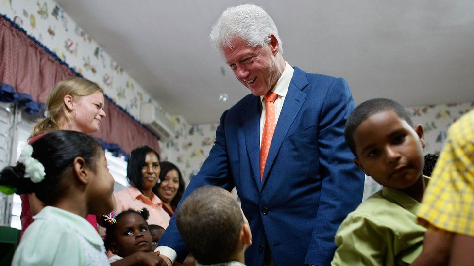 Bill Clinton, pictured in 2007, greeting children at a Santo Domingo hospital