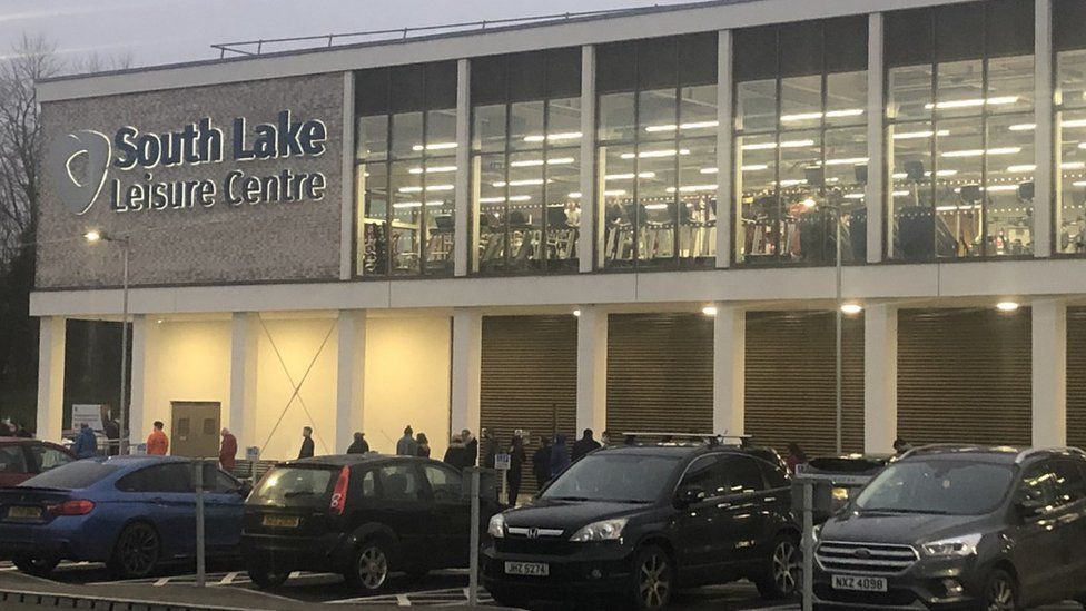 People queue for vaccines at South Lake Leisure Centre in Craigavon