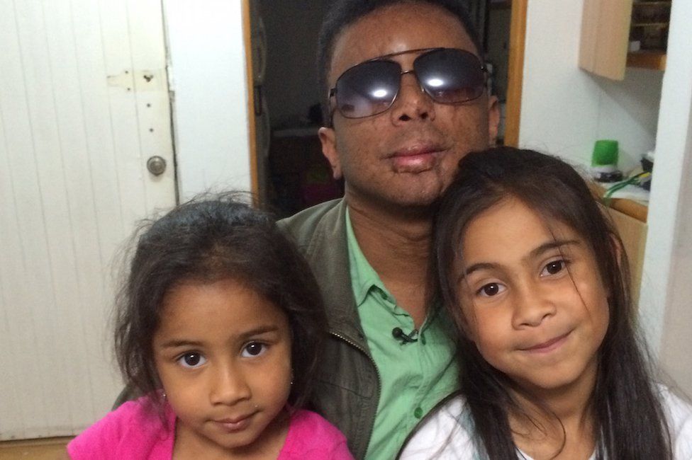Man with two daughters