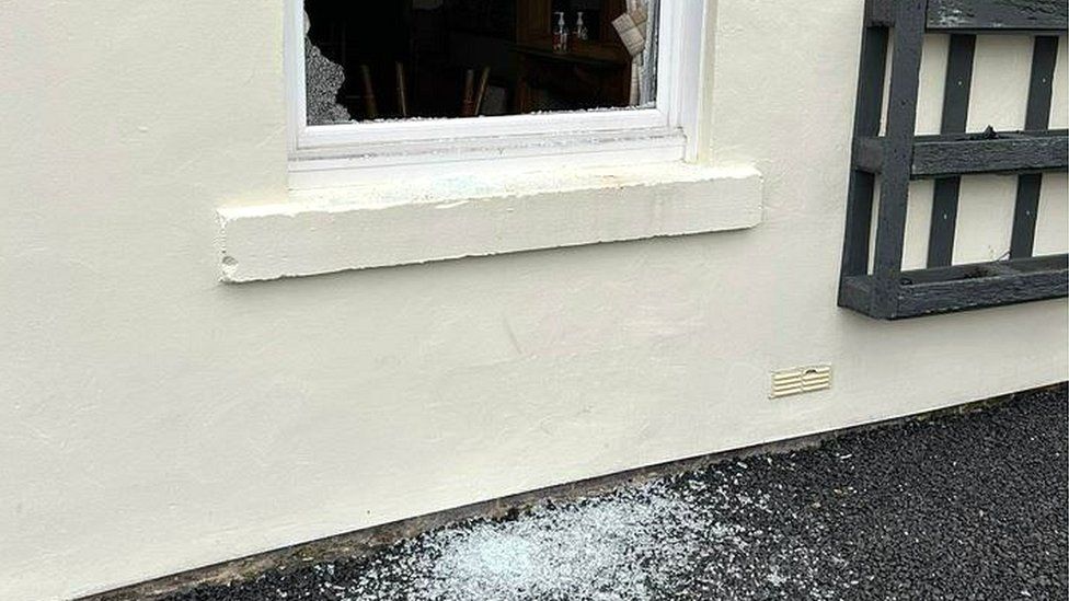 Smashed pub window
