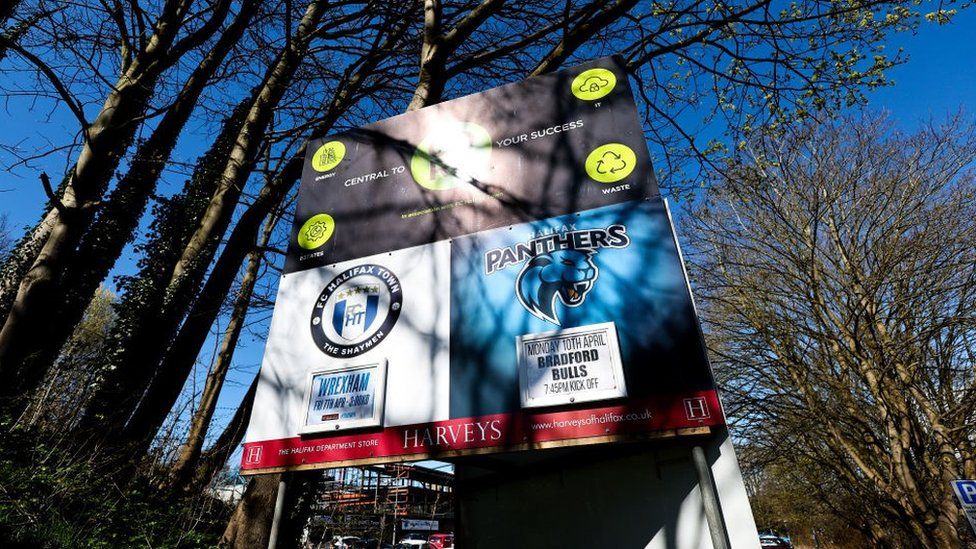 Fixtures board outside The Shay stadium