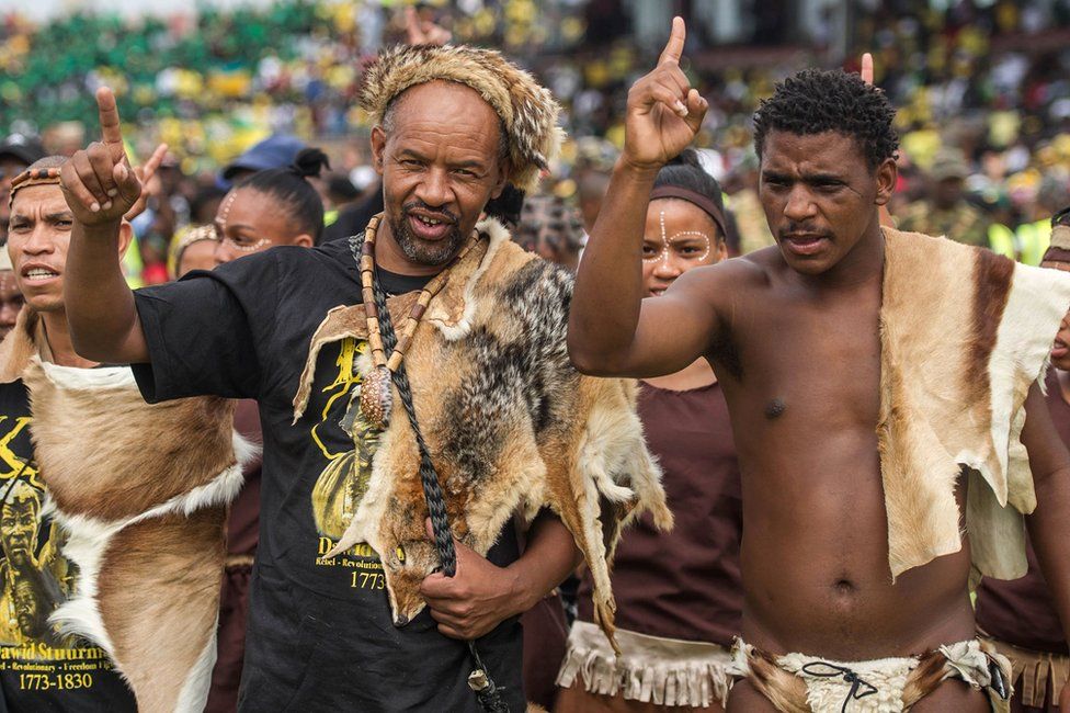 Members of the Khoisan community attend the African National Congress's (ANC) 106th anniversary celebration at Absa Stadium in East London on January 13, 2018. The new head of South Africa's ruling ANC, Cyril Ramaphosa, pledged on January 13, 2018 to "restore the credibility" of the party after a spate of graft scandals involving President Jacob Zuma.