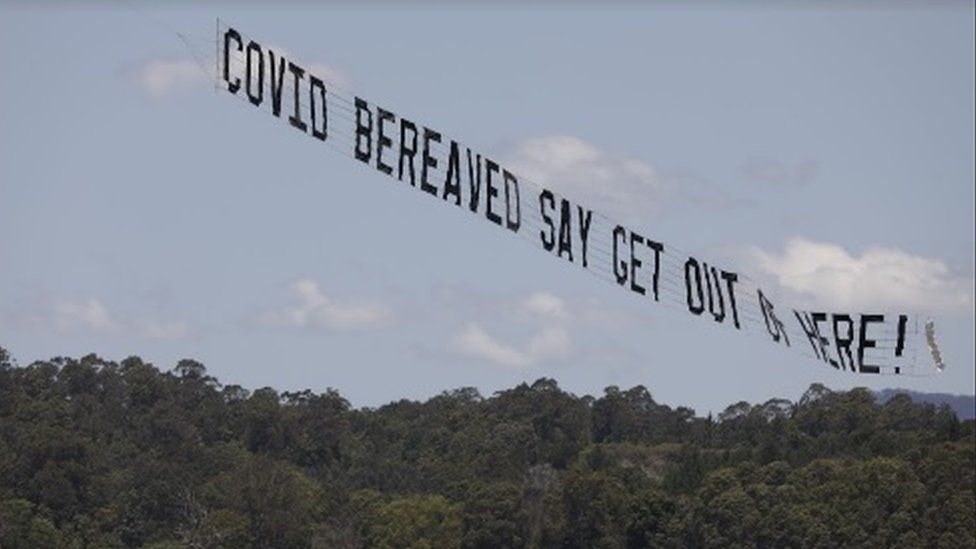 The 35-metre banner circled the campsite for two hours on Tuesday