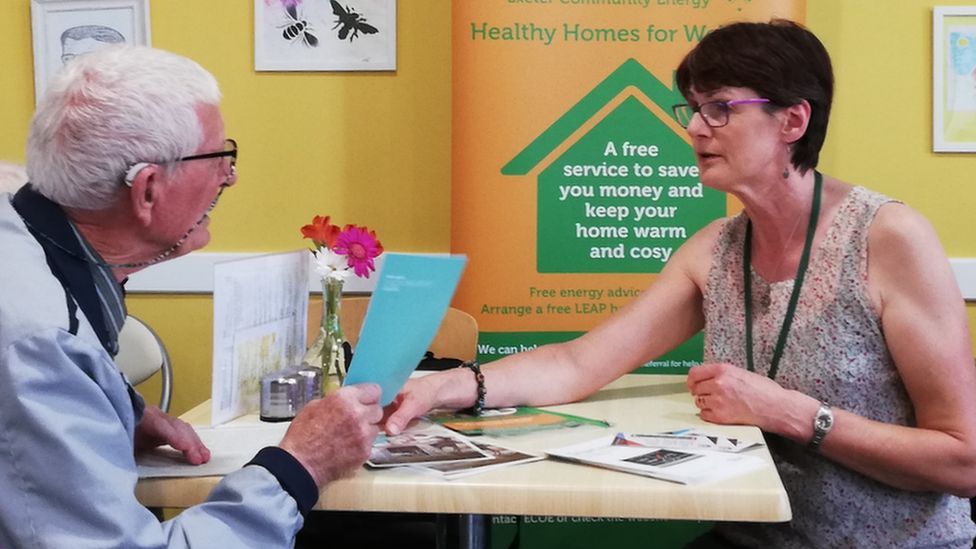 A resident receiving energy advice