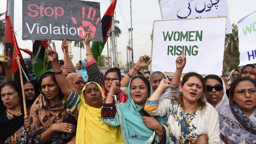 Activists of The Pakistan People's Party hold placards at rally to mark International Women's Day in Karachi on March 8, 2016