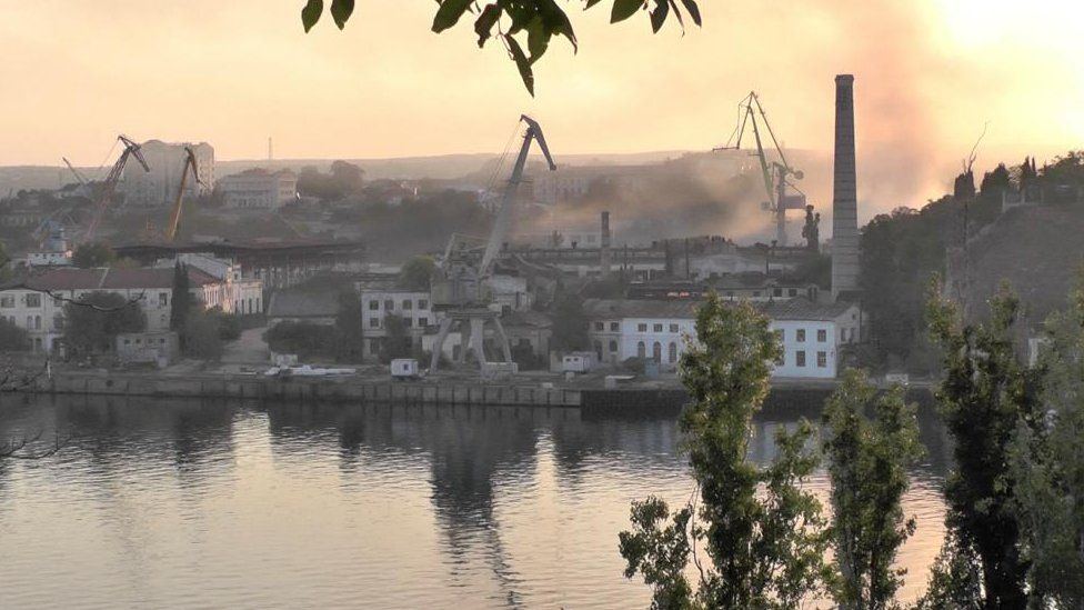 Smoke rises from a shipyard in the Russian-held Crimean port of Sevastopol