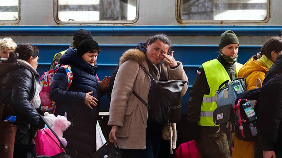 People from Ukraine arrive at the main railway station in Przemysl, Poland