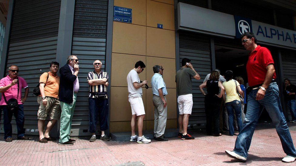 People queue for a cash machine in Athens, 28 June 2015