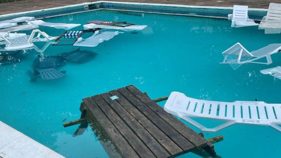 Furniture thrown into a swimming pool