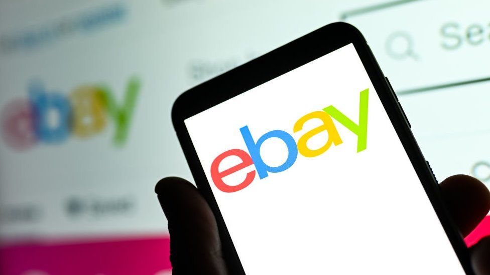 An eBay logo on a phone