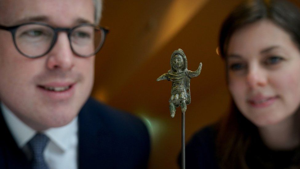 Heritage Minister Lord Parkinson with Curatorial and Learning Officer Sarah Harvey, look at the Birrus Britannicus Roman figurine during a visit to Chelmsford Museum in Essex, to discuss changes to the definition of "treasure"