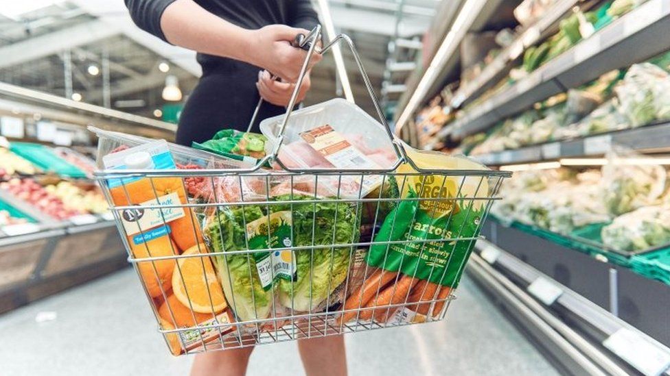 A Morrisons shopper with a shopping basket