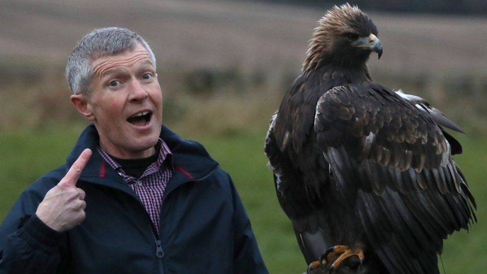 Willie Rennie with a big bird