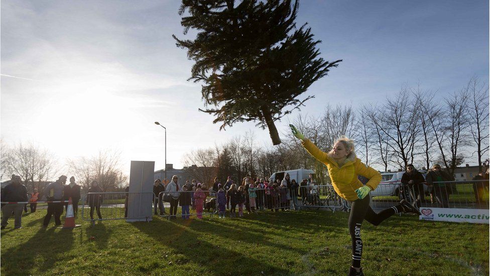 Christmas tree throwing contest held in Ireland BBC News