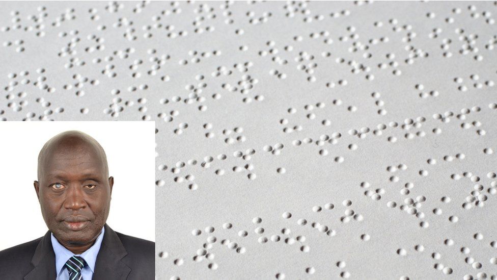 Victor Locoro with a Braille document in the background
