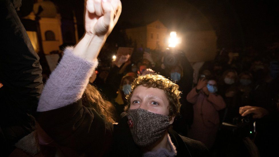 A demonstrator gestures during a protest in Poznan, Poland, 23 October, 2020.