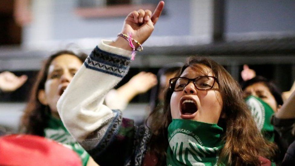 Pro-choice demonstrators react during a protest outside the National Assembly