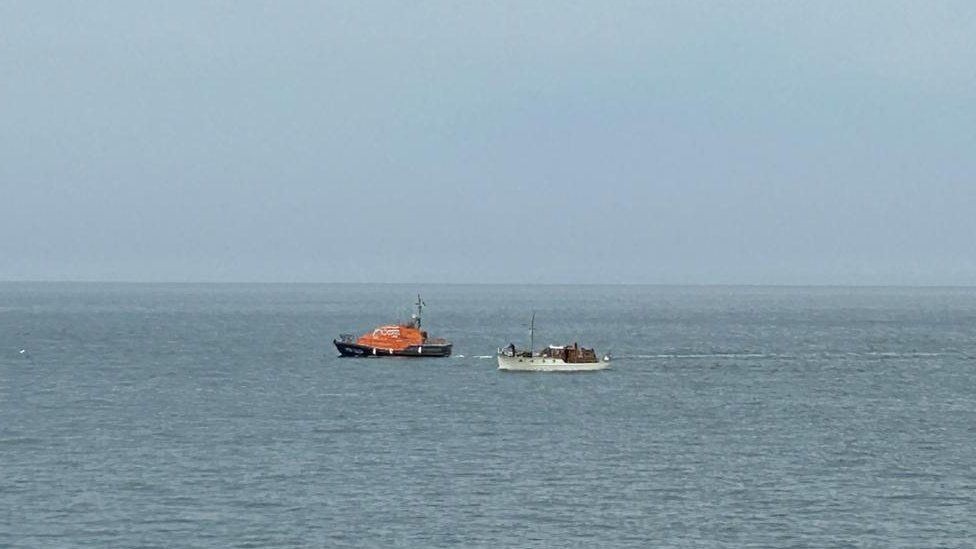 A lifeboat assisting Mimosa