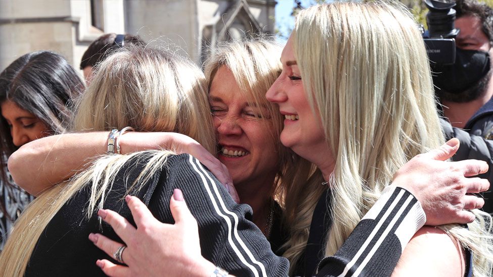 Former post office worker Janet Skinner (centre), with her niece Hayley Adams (right) and her daughter Toni Sisson, celebrating outside the Royal Courts of Justice, London, after having her conviction overturned by the Court of Appeal. Thirty-nine former subpostmasters who were convicted of theft, fraud and false accounting because of the Post Office's defective Horizon accounting system have had their names cleared by the Court of Appeal, on 23 April 2021