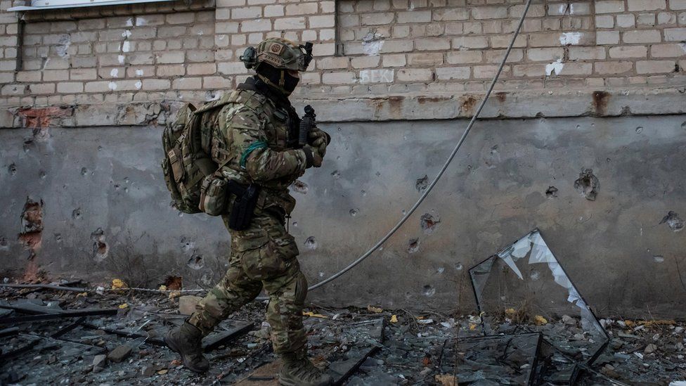 A Ukrainian soldier walks in Bakhmut.