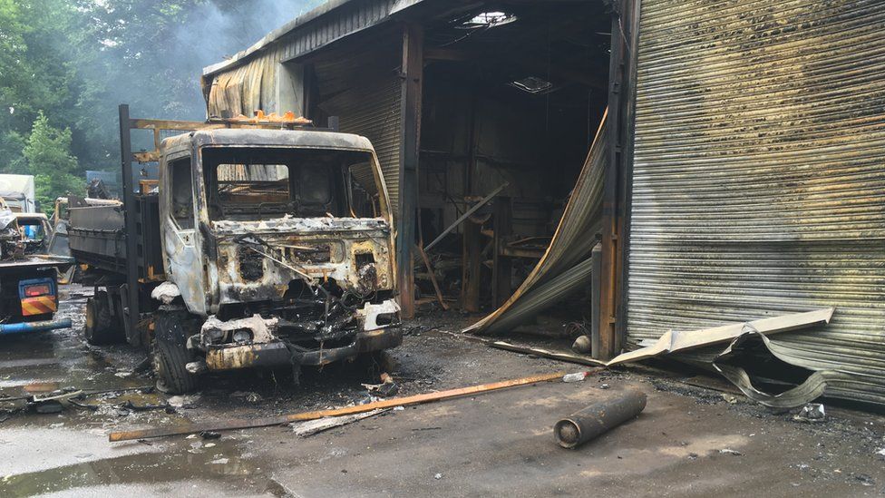 A large van destroyed by the fire