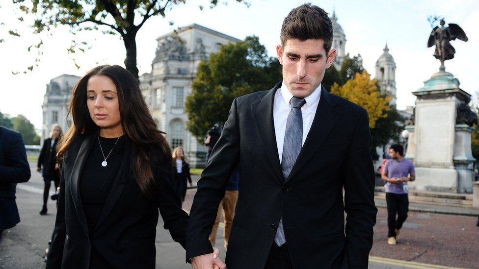 Ched Evans leaves court with his fiancee Natasha Massey