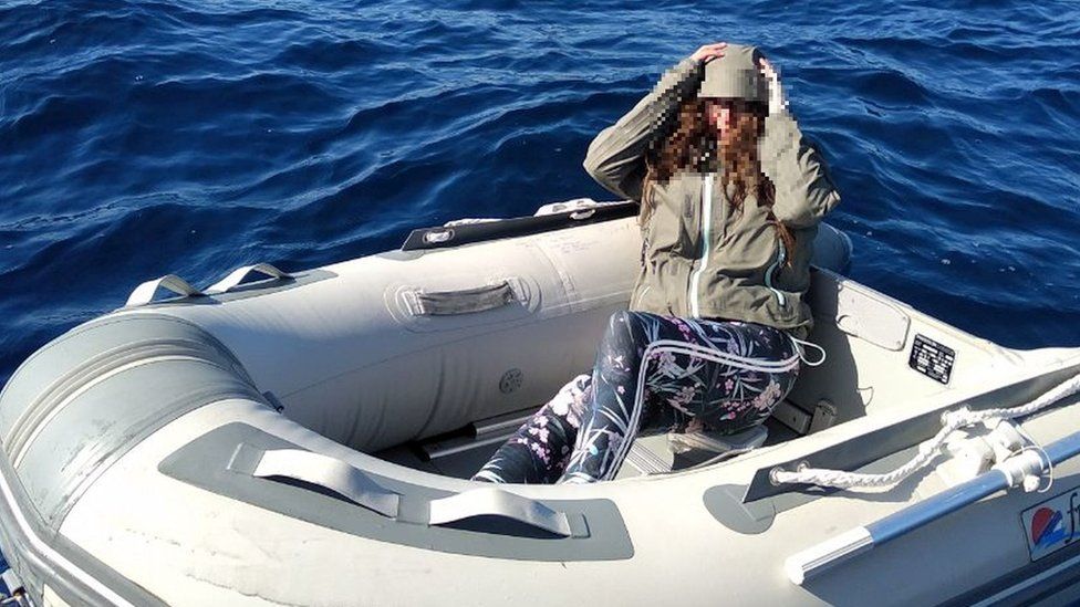 Kushila Stein in her rubber dinghy after being rescued by the Hellenic Coast Guard