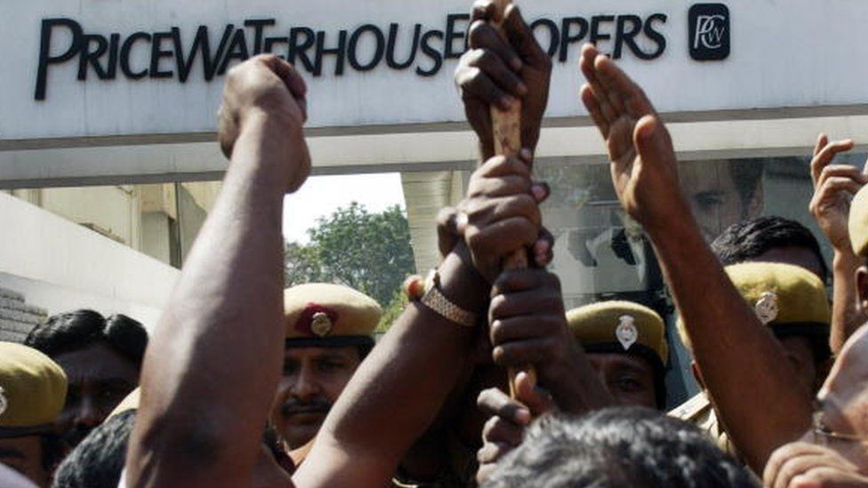 Members of the Communist Party of India (CPI) protest outside the office of PricewaterhouseCoopers, the auditing firm for the scandal-hit Satyam Computers, in Hyderabad on January 20, 2009 calling for the closure of the audit firm and the cancellation of license.