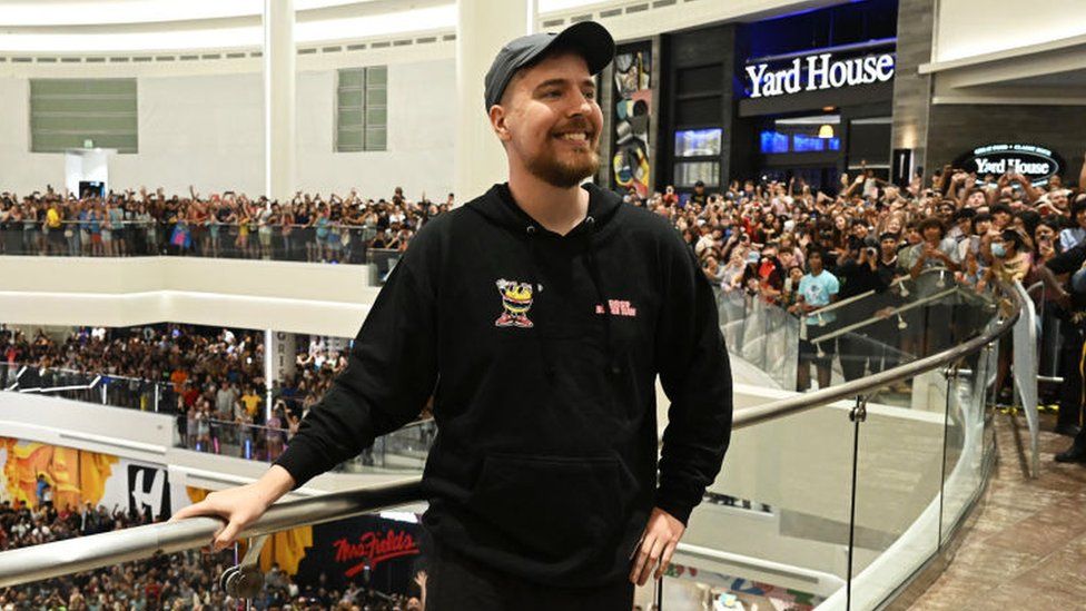 MrBeast in a crowded shopping centre, full of his fans