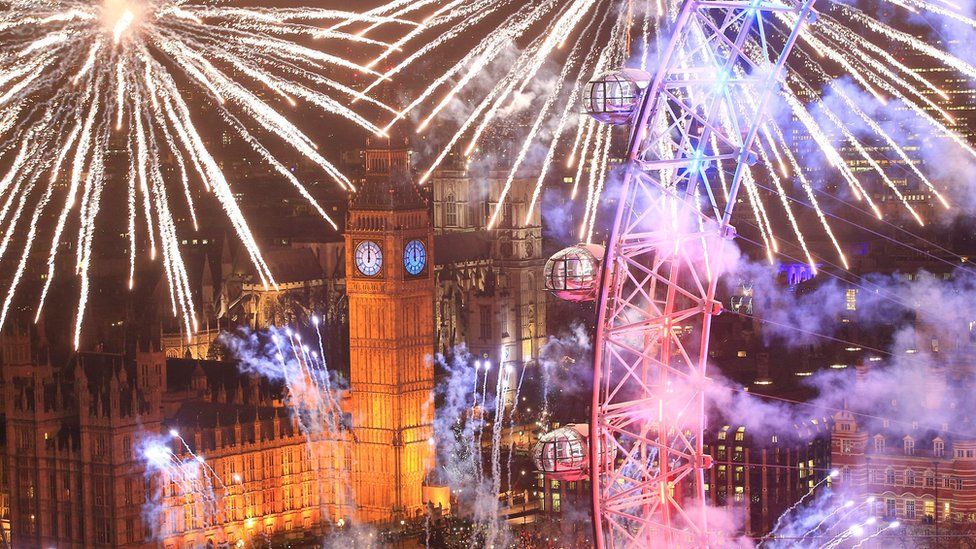 Fireworks light up the sky over the London Eye in central London