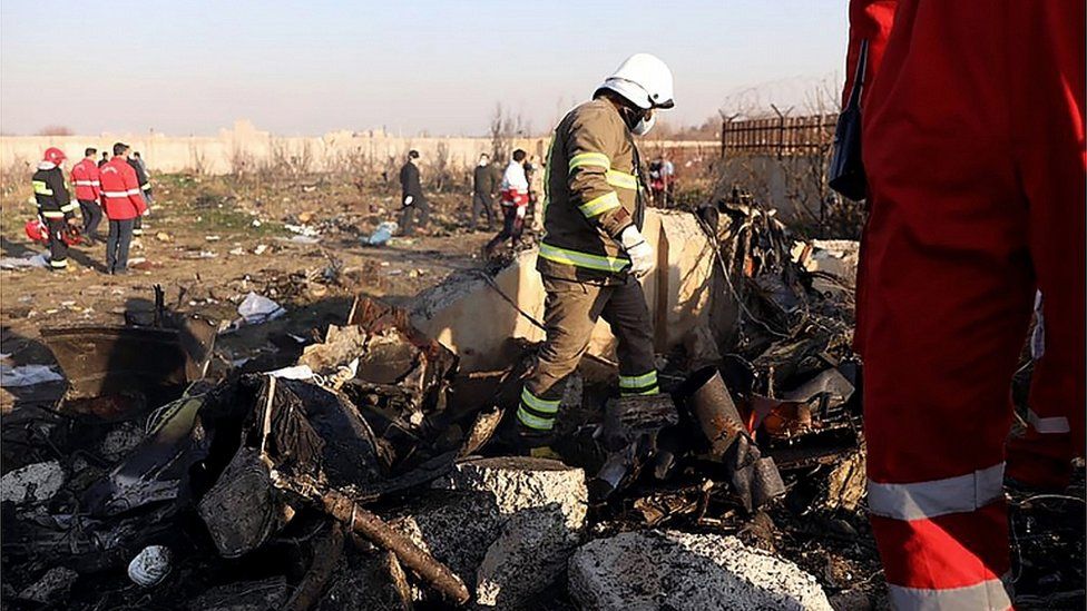 Rescue teams are pictured amid the wreckage after a Ukrainian plane carrying 176 passengers crashed near Imam Khomeini airport in the Iranian capital Tehran early in the morning on January 8, 2020