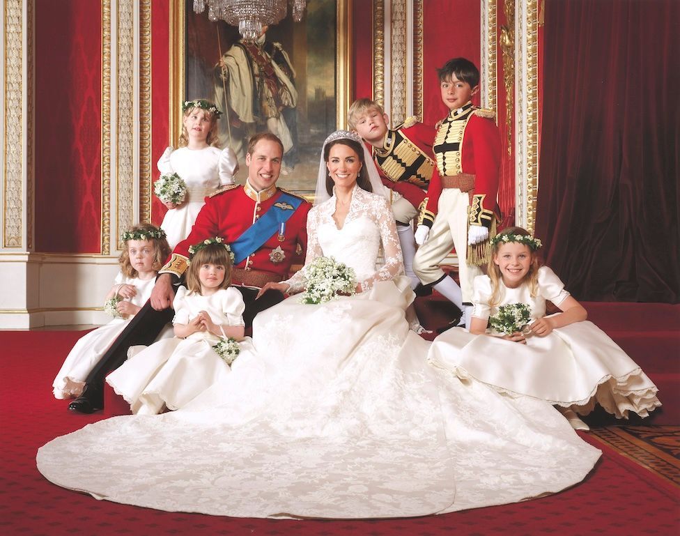The Prince and Princess of Wales surrounded by their young bridesmaids and pages at their wedding in 2011