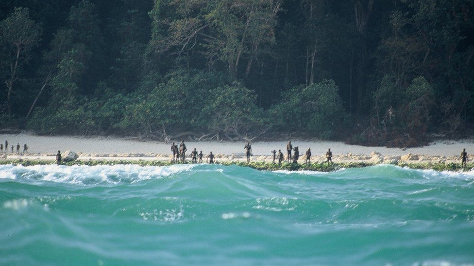 The Sentinelese stand guard on an island beach in 2005