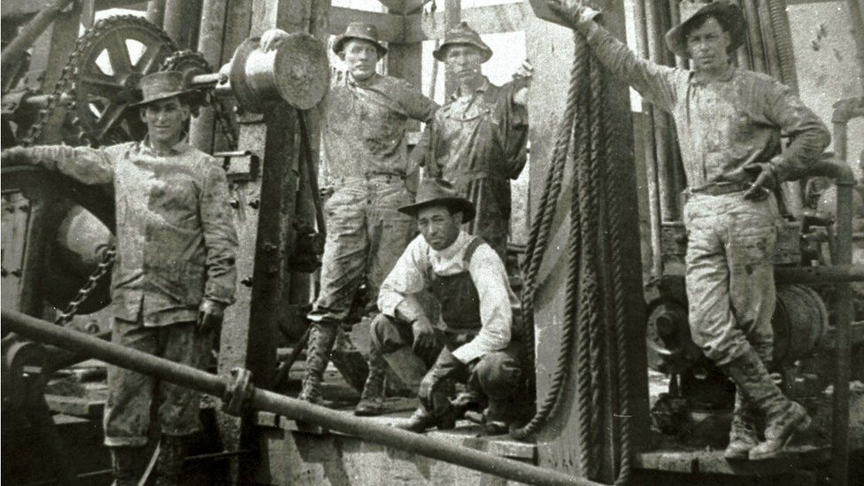 A drilling crew poses for a photograph at Spindletop Hill in Beaumont, Texas where the first Texas oil gusher was discovered in 1901.