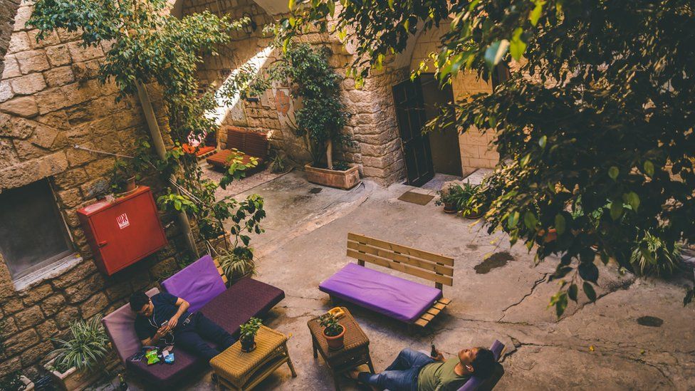 Tourists in Fauzi Azar Inn's courtyards