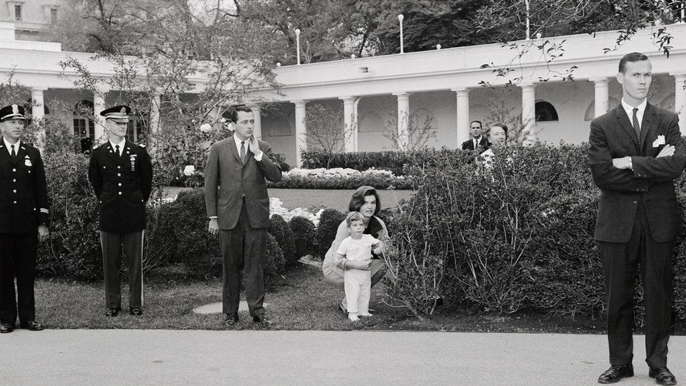 Jacqueline Bouvier Kennedy and her son John Jr in the south grounds of the White House in 1962