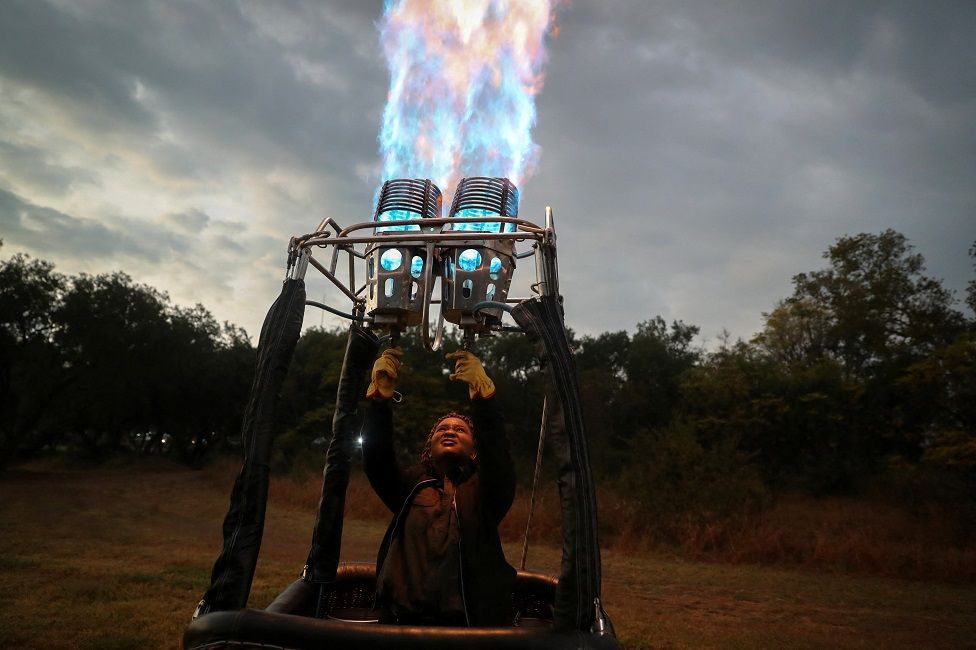 Semakaleng Mathebula, South Africa"s first Black female hot-air balloon pilot releases propane gas in preparation for take off in Johannesburg, South Africa, May 15, 2022
