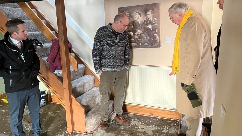Marc Lidderth, Alistair Sinclair and the Duke inside a house that has no flooring