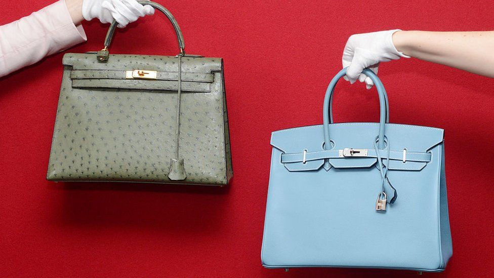 A Hermes Birkin and a Hermes Kelly at a pre- auction photo calls for Hermes handbags at Bonhams