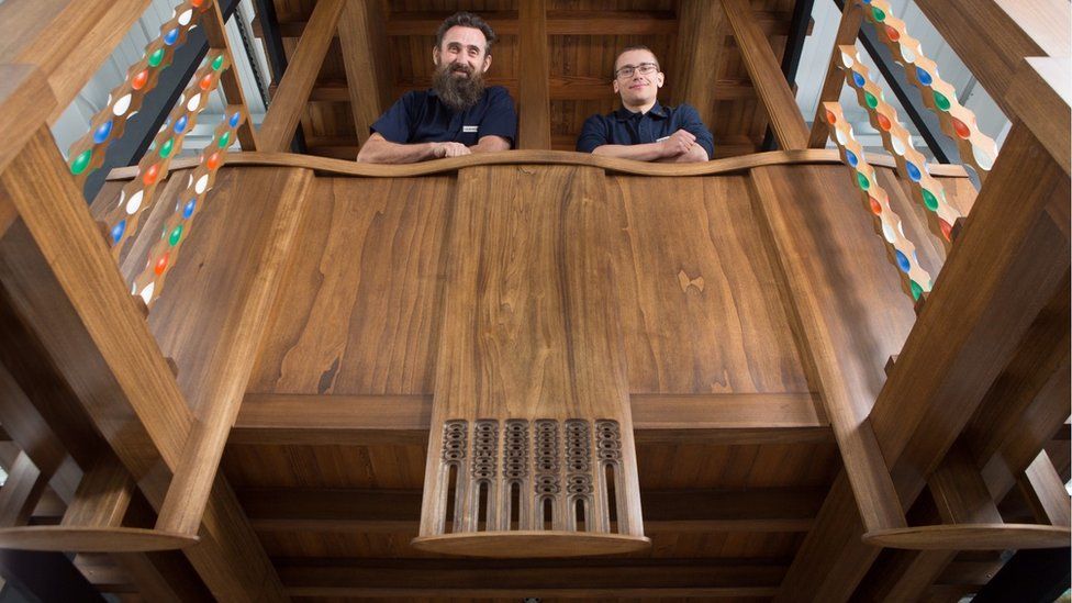 master craftsmen Angus Johnson and Martins Cirulis of Laurence McIntosh in a full-size model of a section of the fire-gutted Mackintosh Library