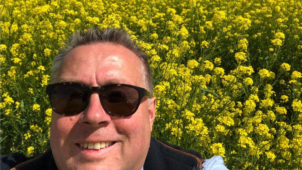 Michael Sly in a field of mustard